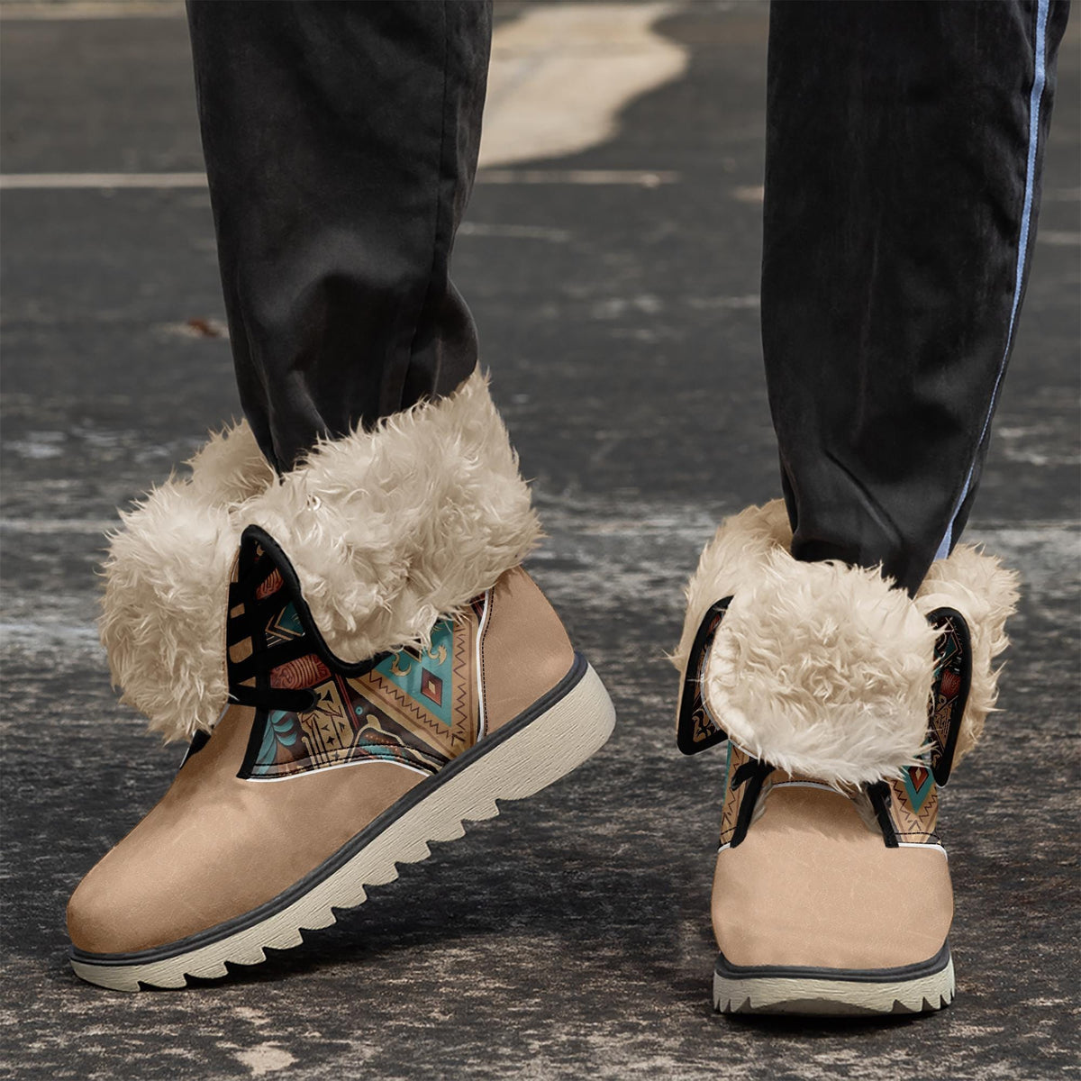 A close-up of a person's feet wearing tan boots with fur trim and colorful designs on the sides.