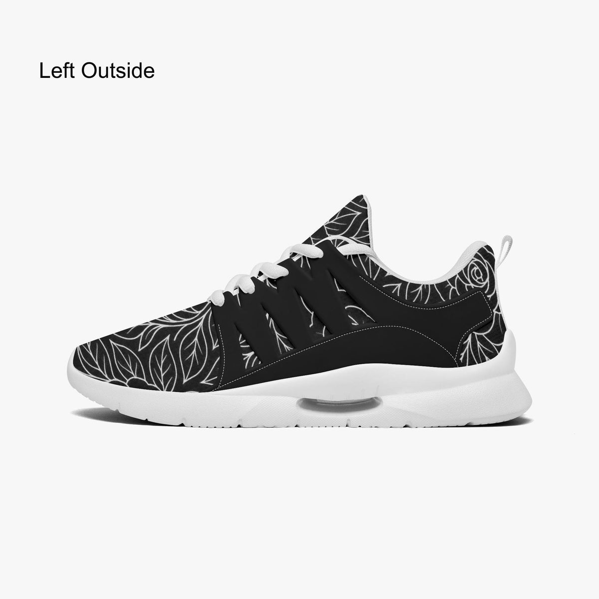 A black and white sneaker with a leaf pattern design.