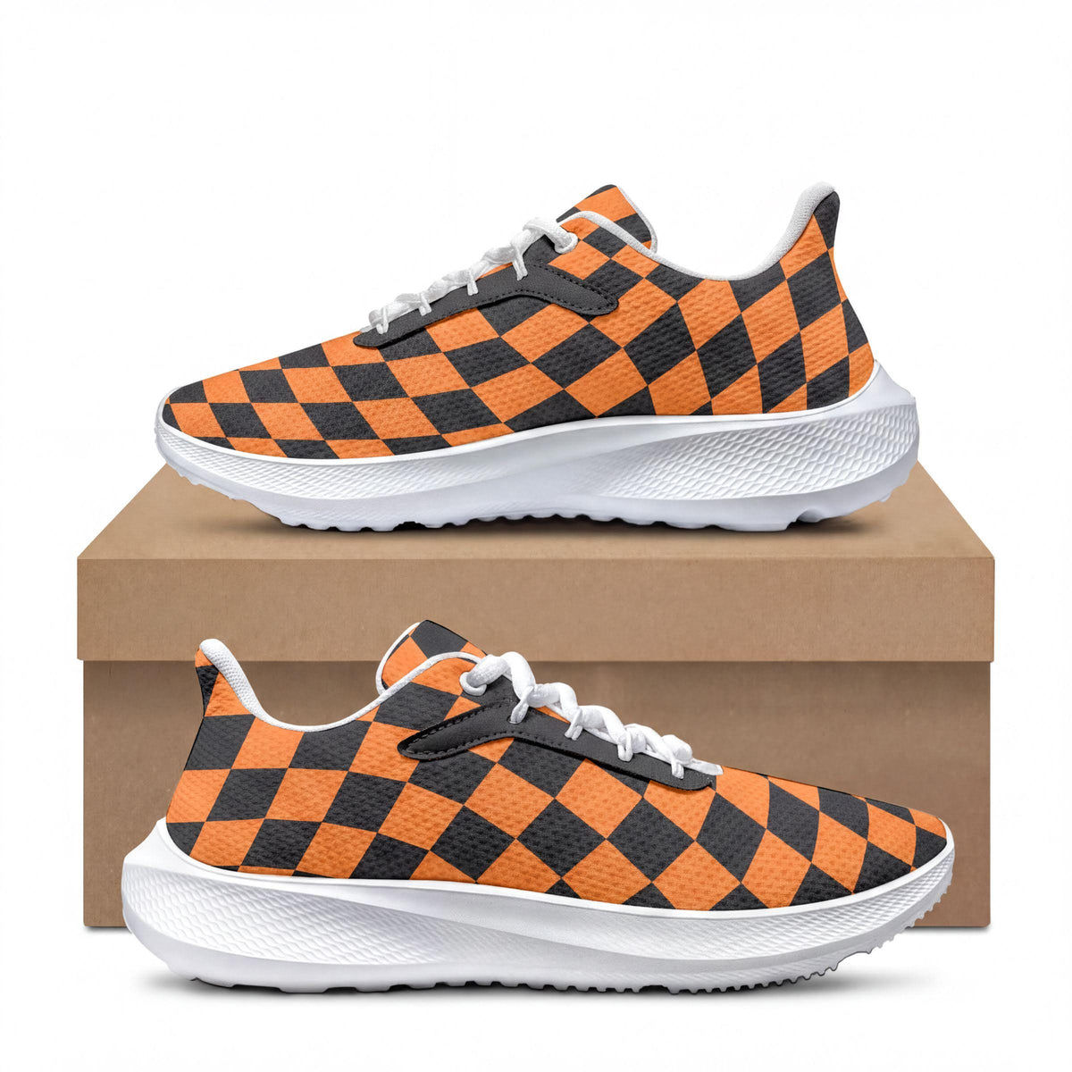 A pair of orange and black checkered sneakers placed on top of a cardboard box.