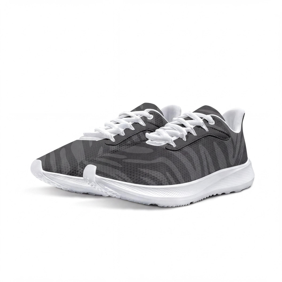 A pair of black and white sneakers with a zebra print pattern.