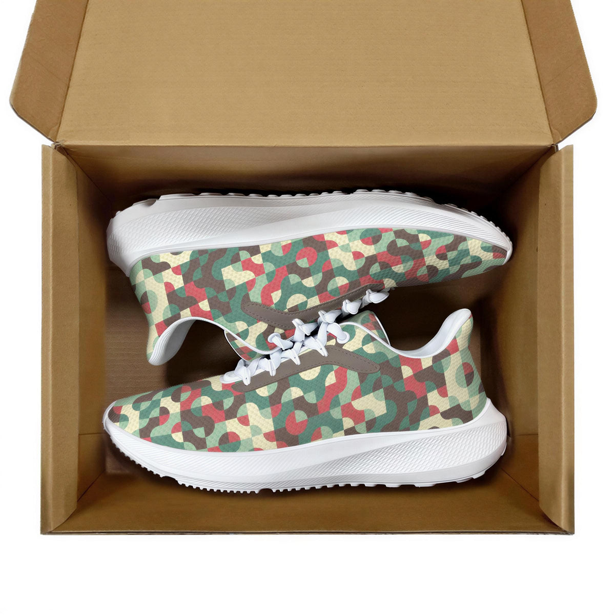 A pair of camouflage-patterned sneakers are displayed inside a cardboard box.