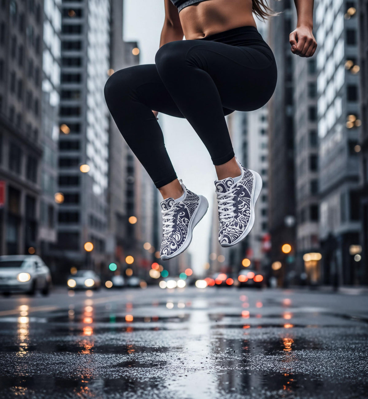 A person wearing black leggings and patterned sneakers is captured mid-jump on a city street, with tall buildings and a wet, reflective surface in the background.