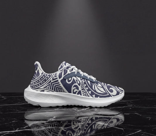 A white and blue patterned sneaker is displayed on a black marble surface, reflecting the image.