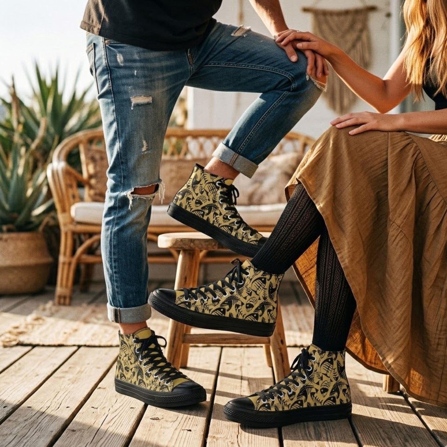 A man and a woman are sitting on a wooden deck, with the man's feet resting on the woman's legs. The man is wearing a pair of high-top sneakers with a floral pattern, and the woman is wearing a brown skirt.