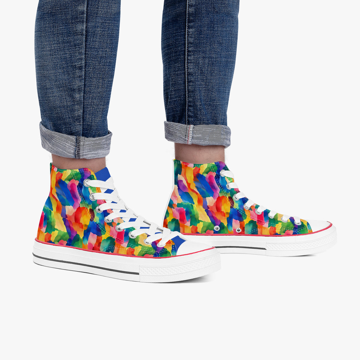 Model wearing jeans with high top sneakers, side view