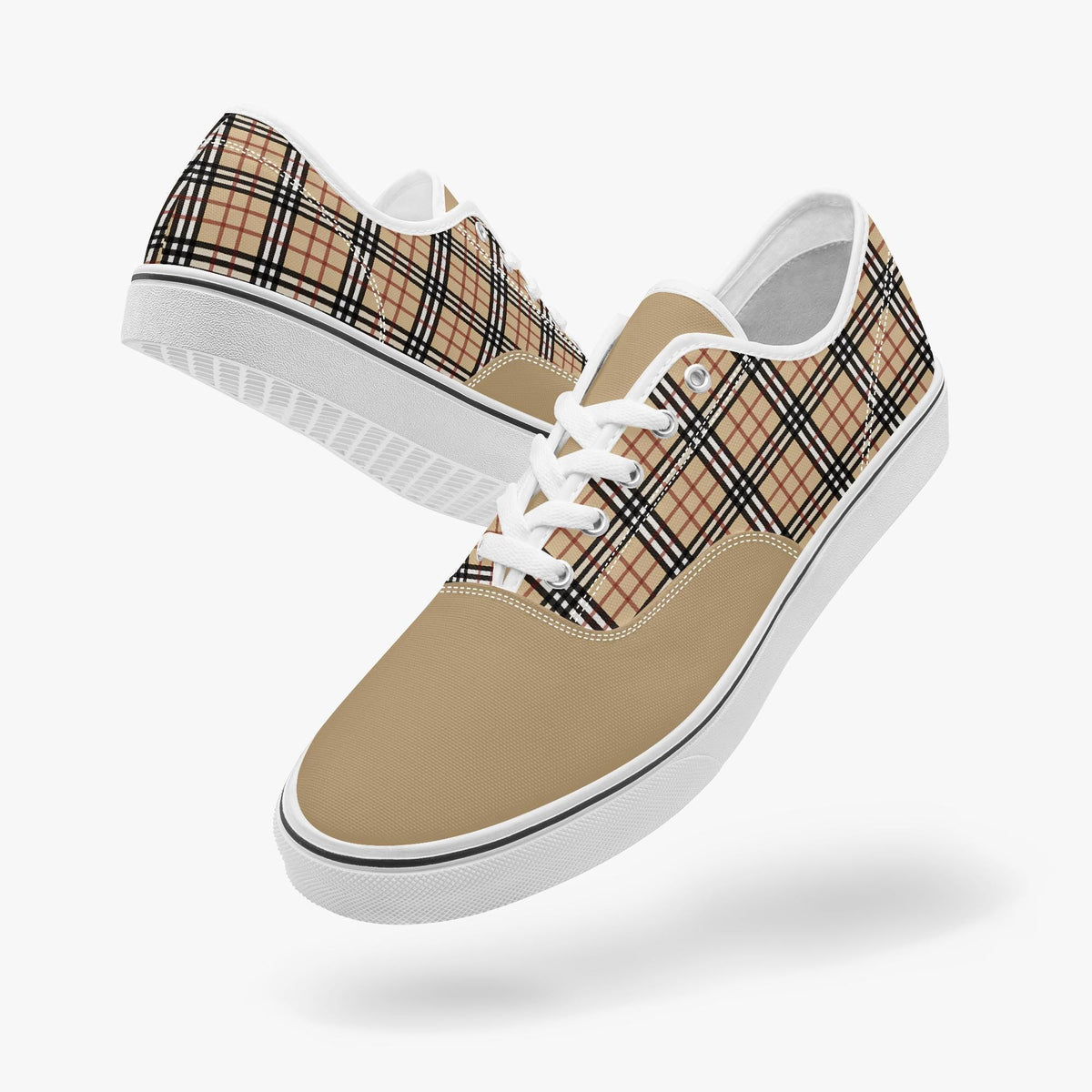 A pair of tan and black plaid sneakers with white laces.