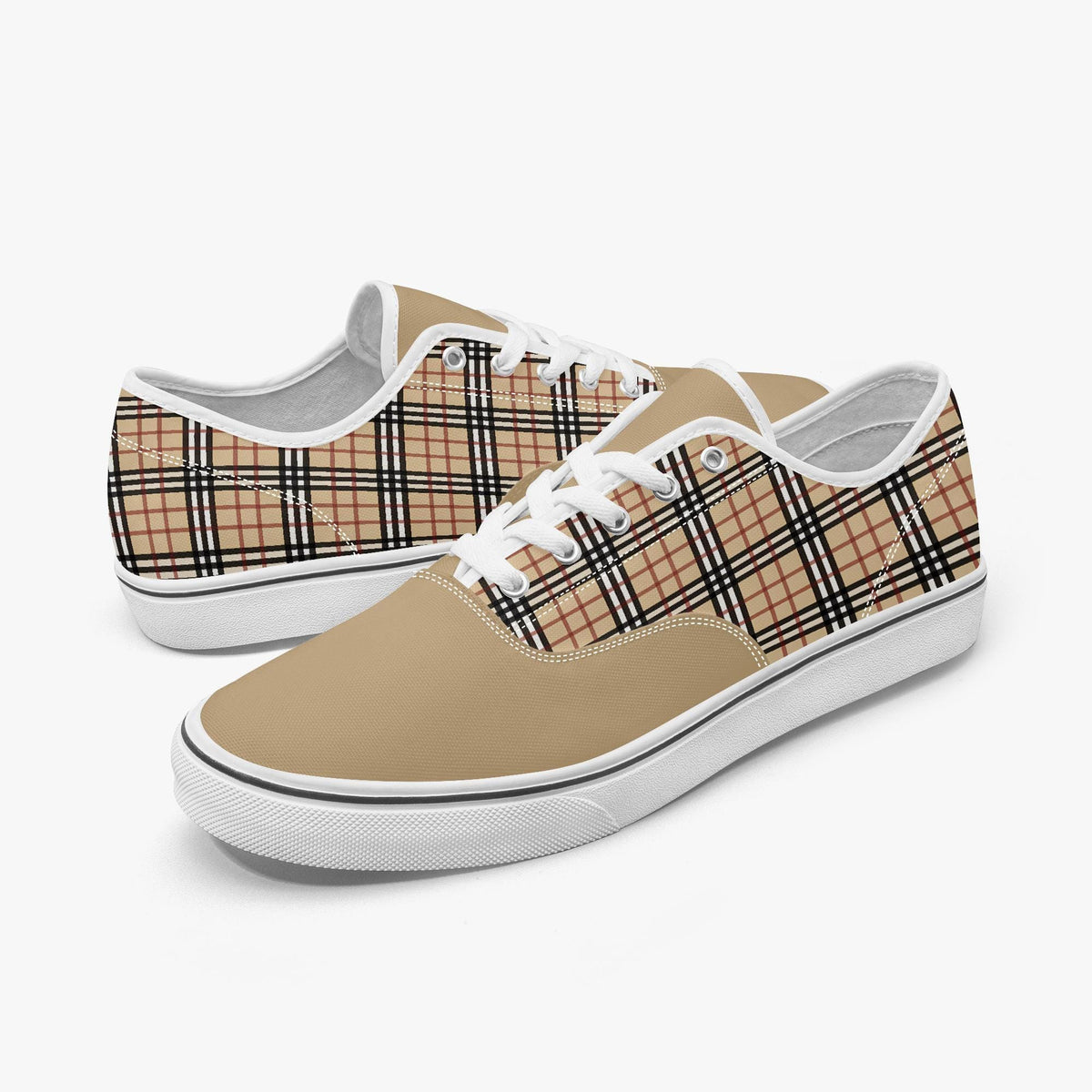 A pair of tan and black plaid sneakers with white laces.