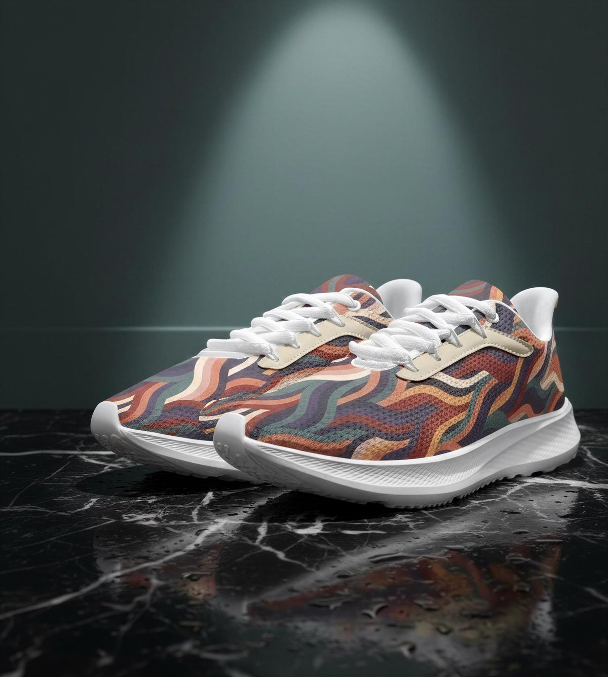 A pair of colorful, patterned sneakers with white laces, displayed on a black marble surface against a dark background.