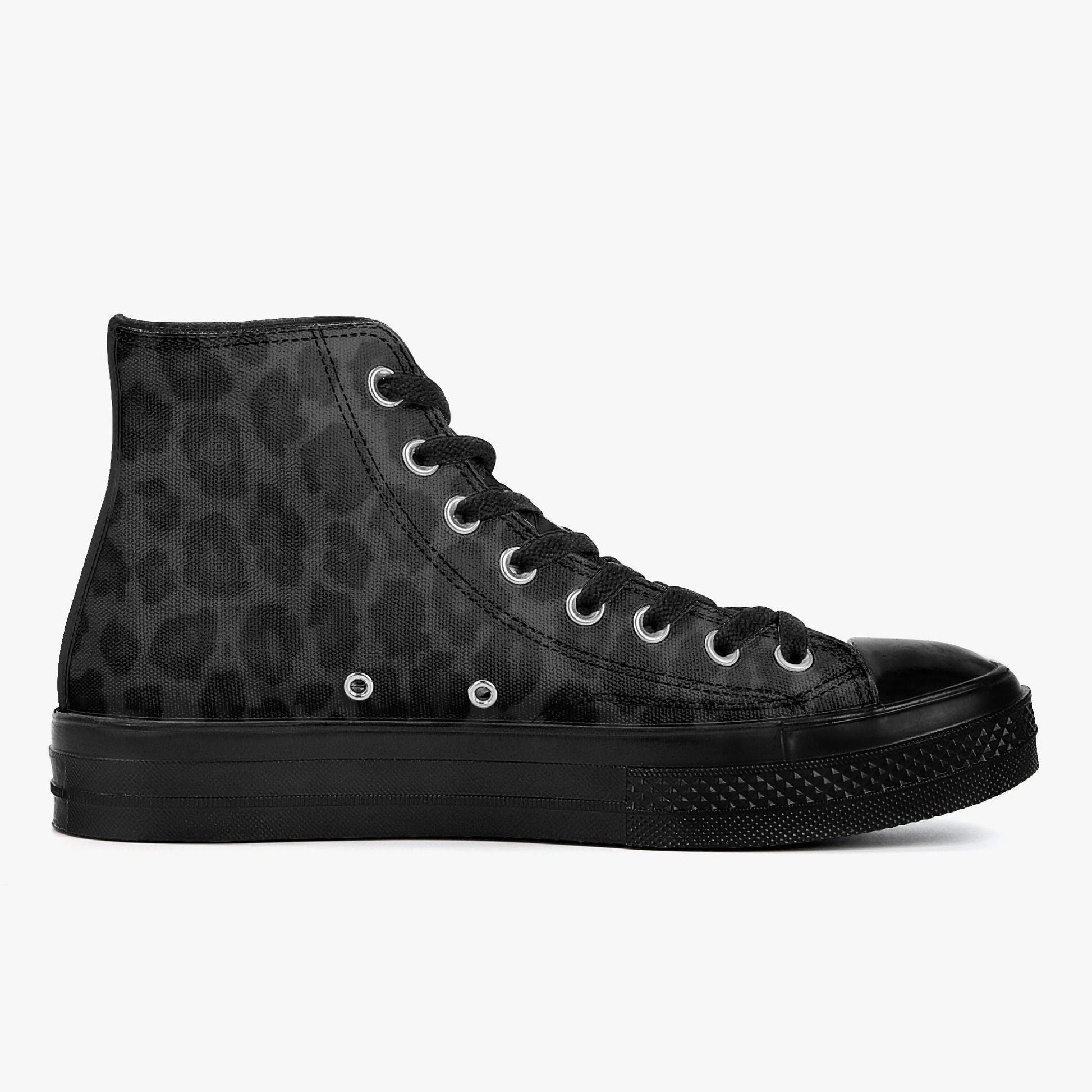 A black high-top sneaker with a leopard print pattern on the upper part.