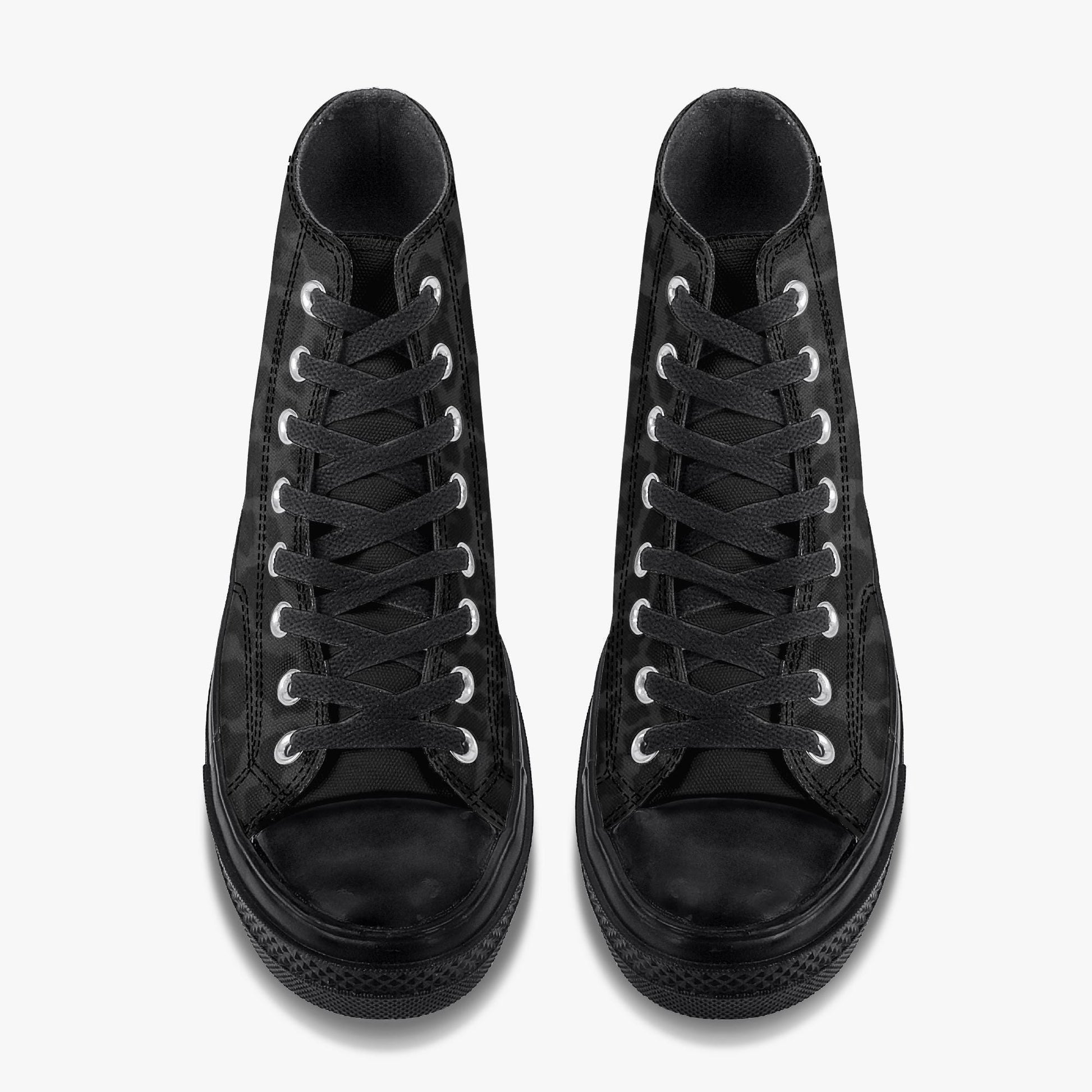 A pair of black high-top sneakers with white laces.