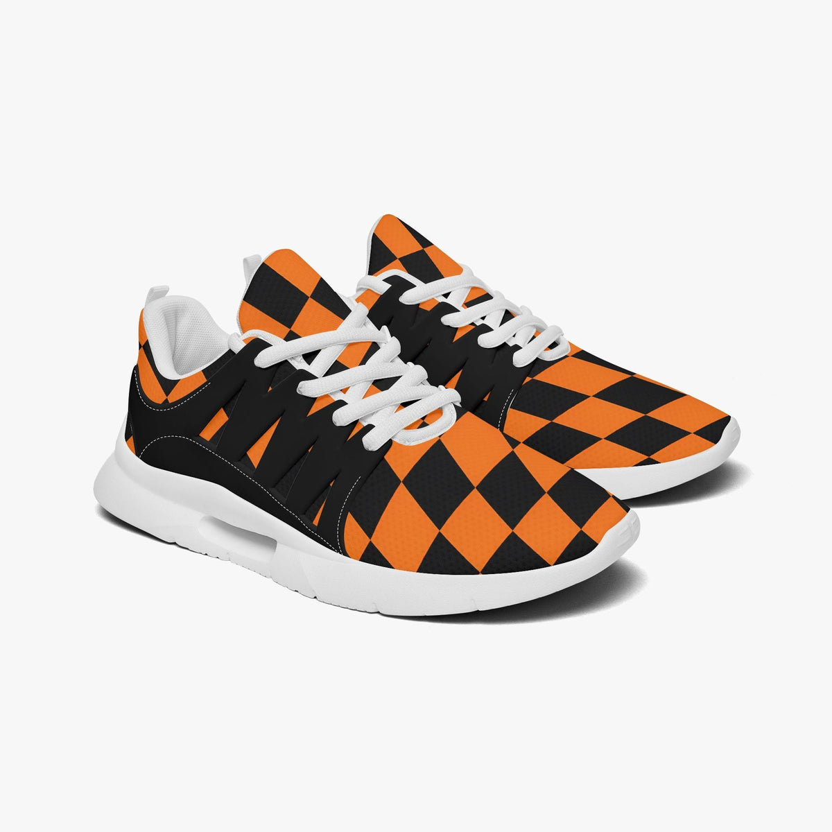 A pair of orange and black checkered sneakers with white laces.