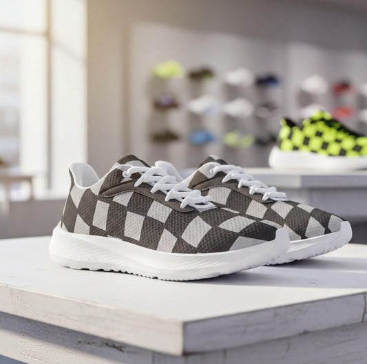 A pair of black and white checkered sneakers with white soles, displayed on a white surface in a retail setting.