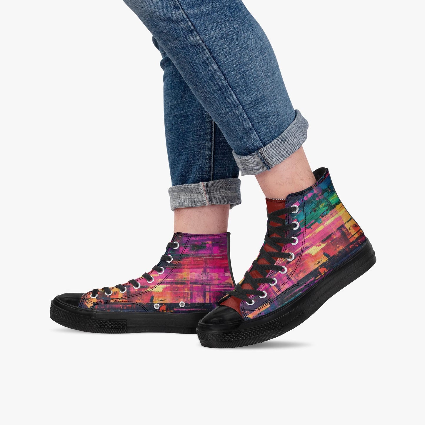 A person wearing blue jeans and colorful high-top sneakers with a vibrant, abstract pattern.