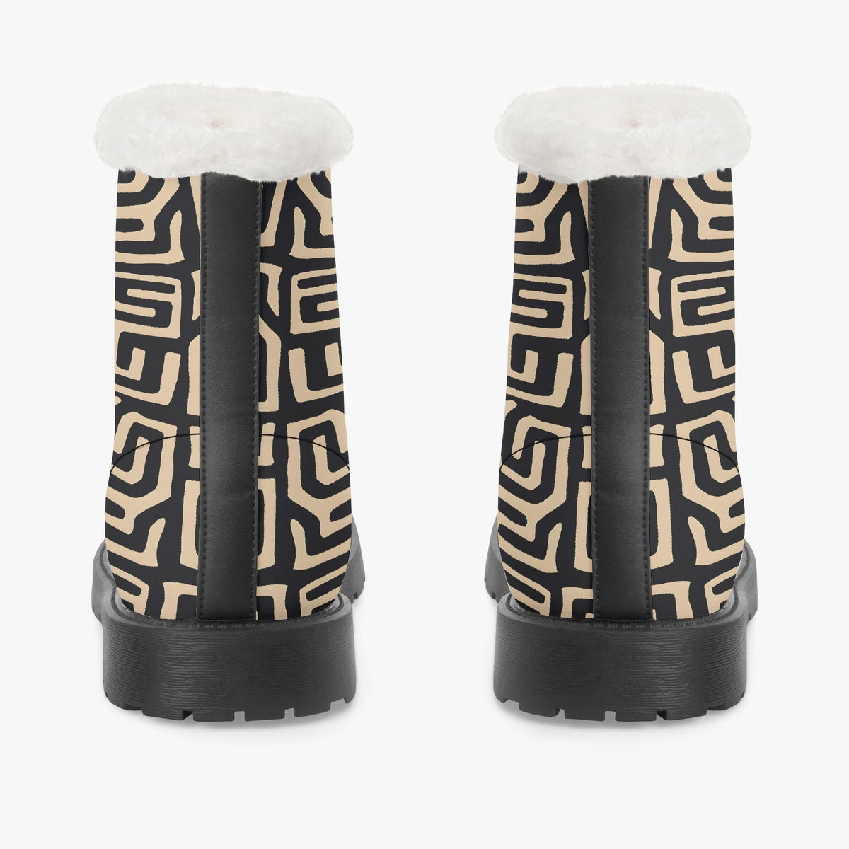 a pair of black and white patterned boots with a white fur lining.