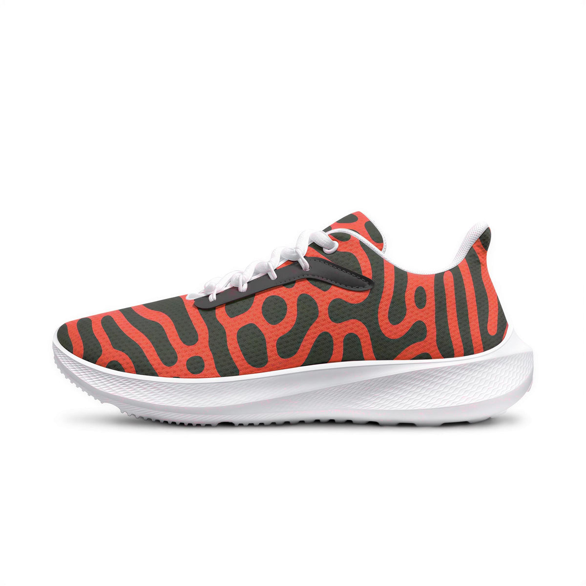 A single sneaker with a bold, abstract pattern in red, black, and orange colors.