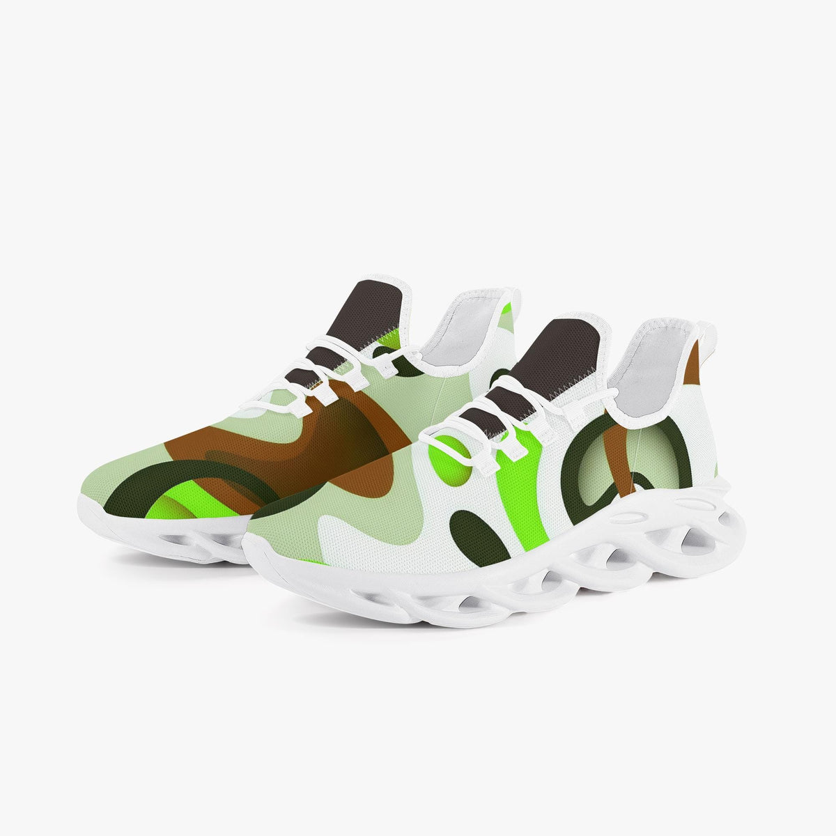 A pair of white and green sneakers with a unique abstract pattern.