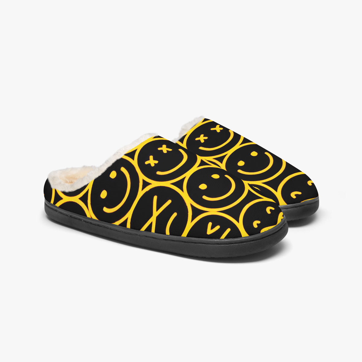Pair of smiley face slippers on white background, three-quarter view