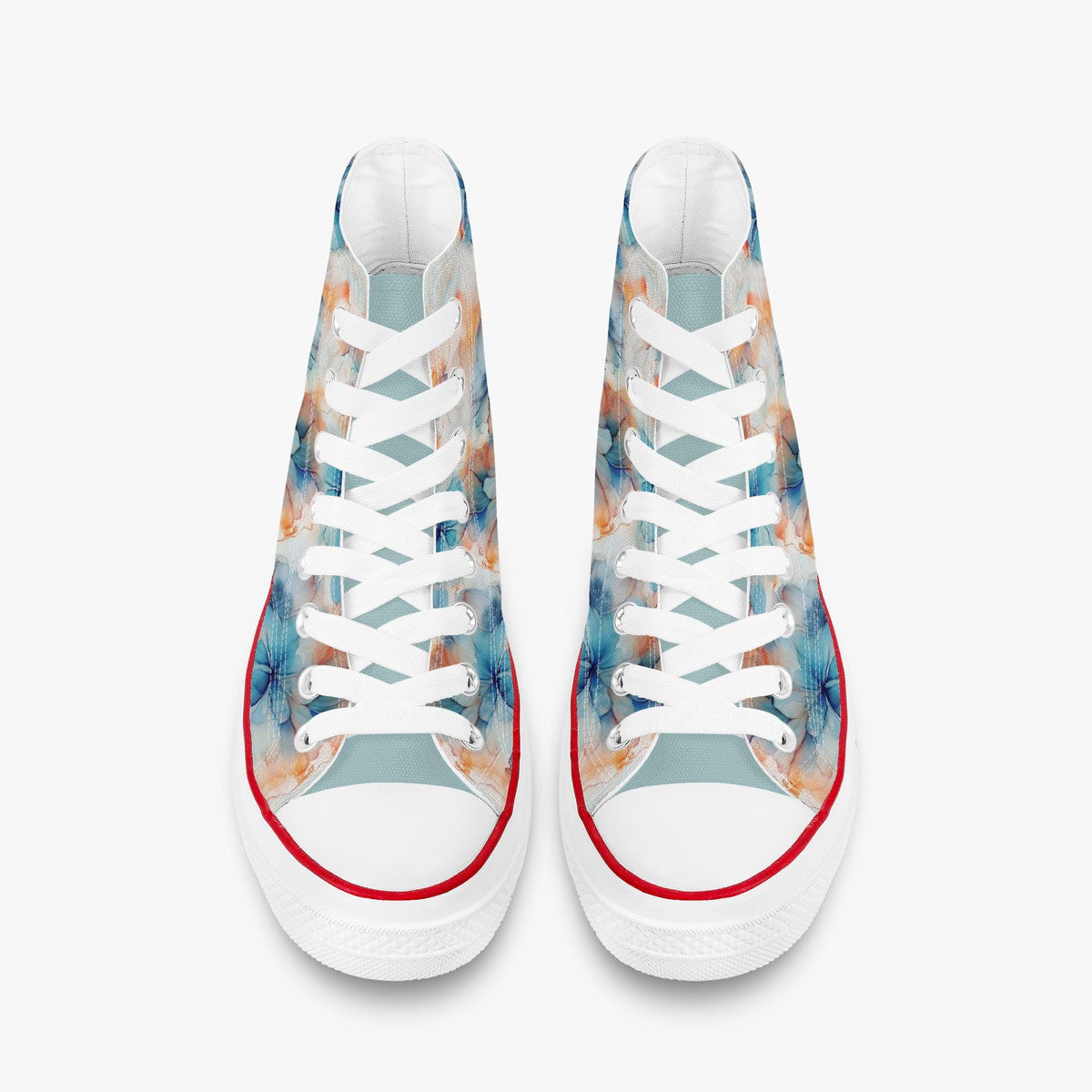 Zijaanzicht van een paar bloemen high-top sneakers op een witte achtergrond