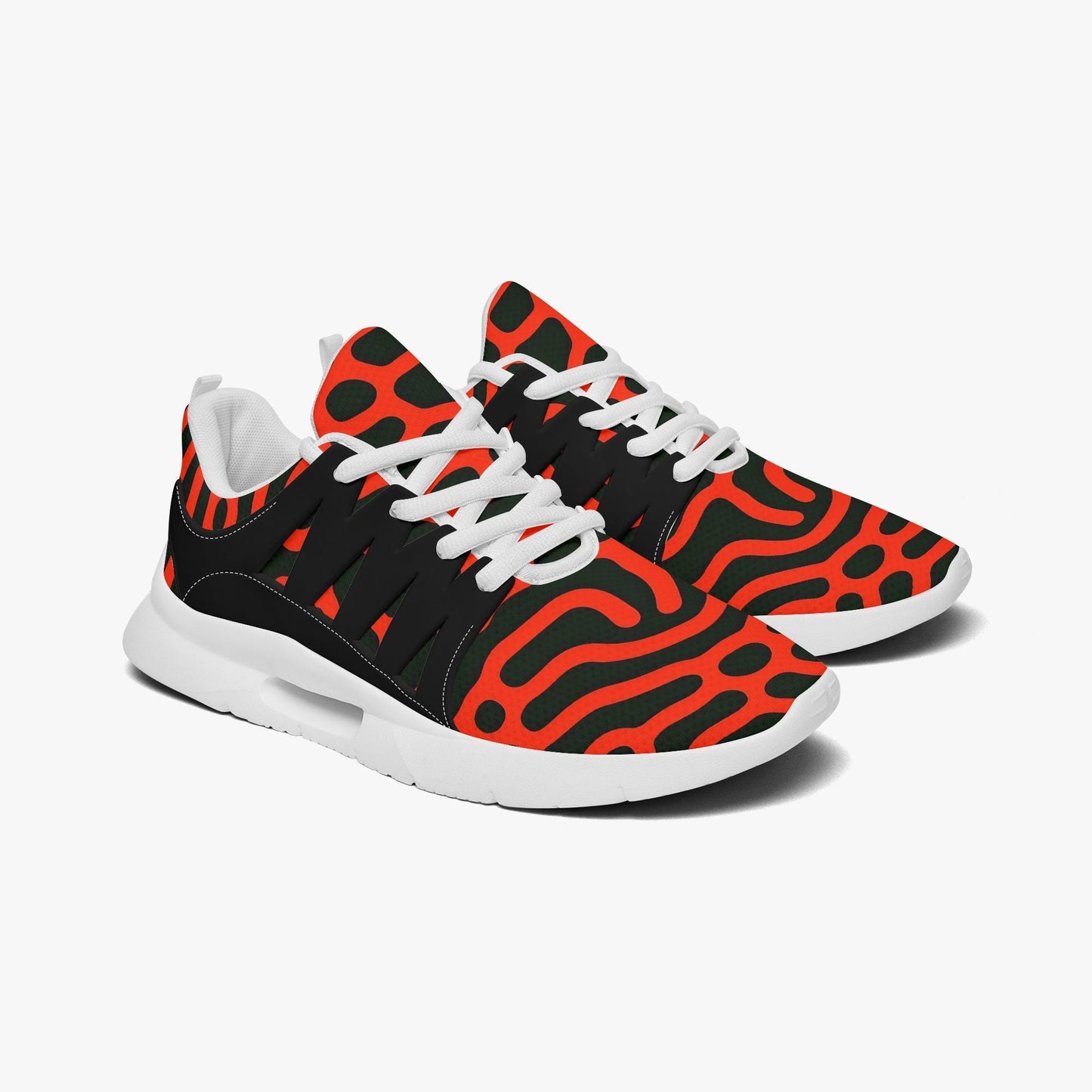 A pair of colorful sneakers with a bold, abstract pattern in red, black, and orange.