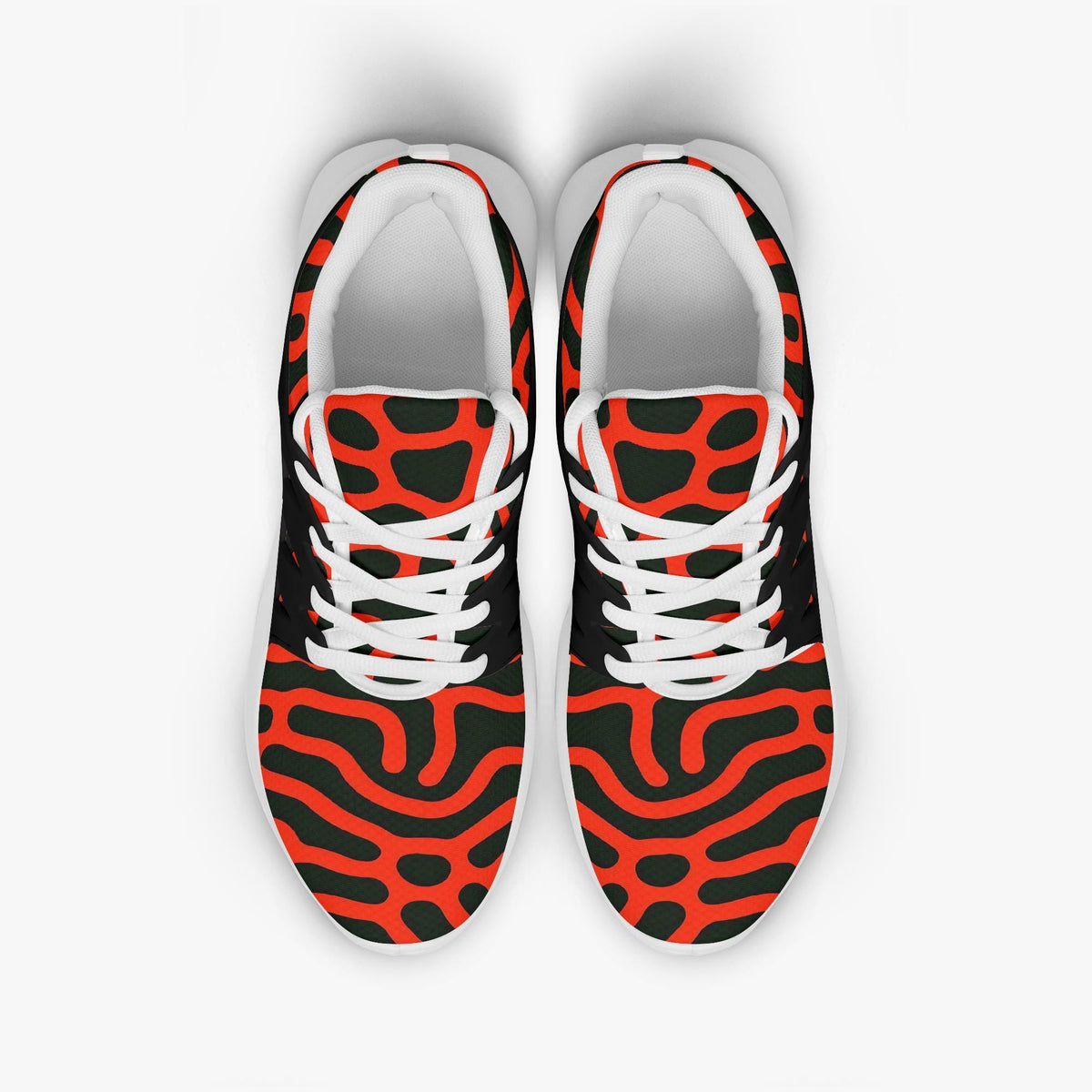 A pair of colorful sneakers with a bold, abstract pattern in red, black, and white.
