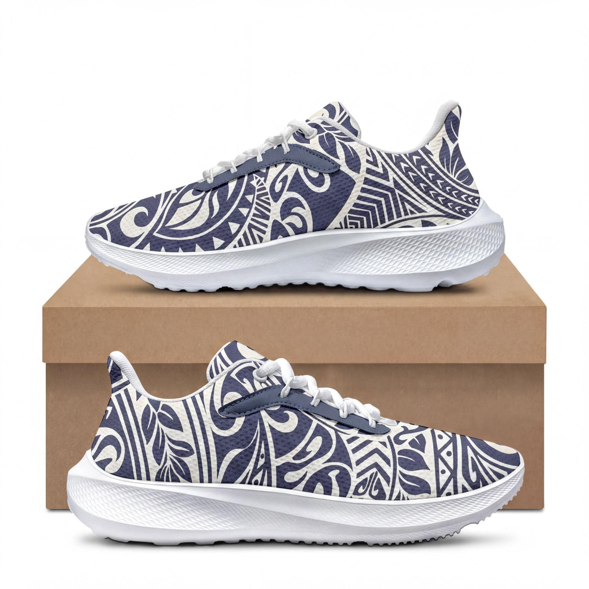 A pair of white and blue patterned sneakers with a floral design, displayed on top of a cardboard box.