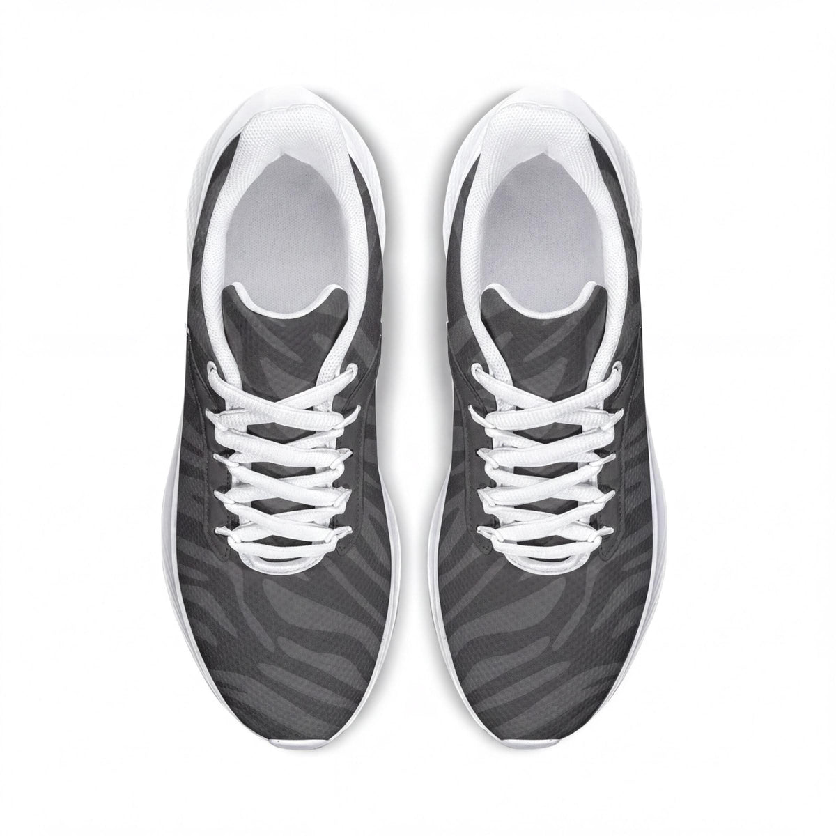 A pair of black and white sneakers with a zebra print pattern.