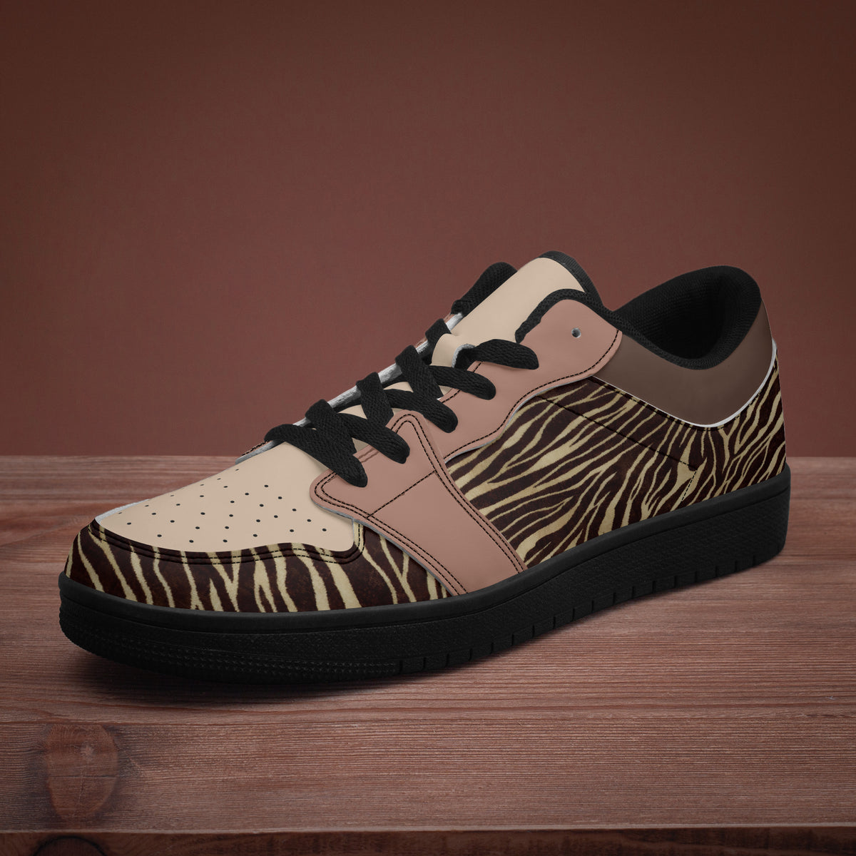 Side view of zebra print sneakers on a wooden surface