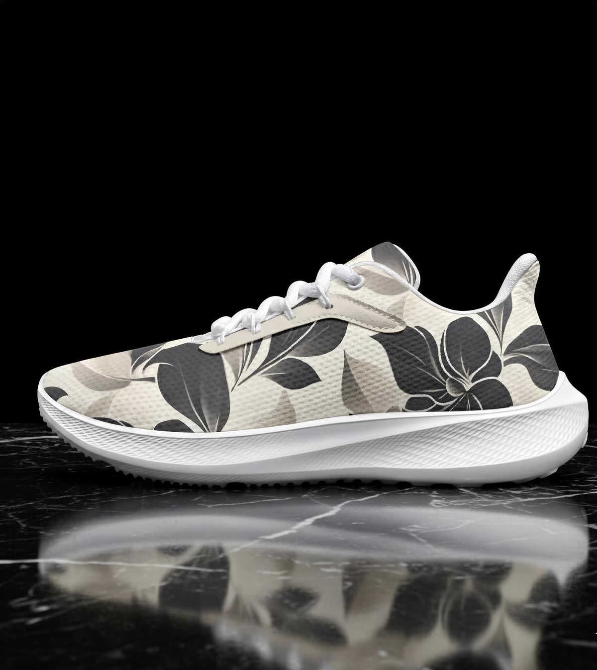 A white and black floral patterned sneaker is displayed on a black marble surface, reflecting the image.