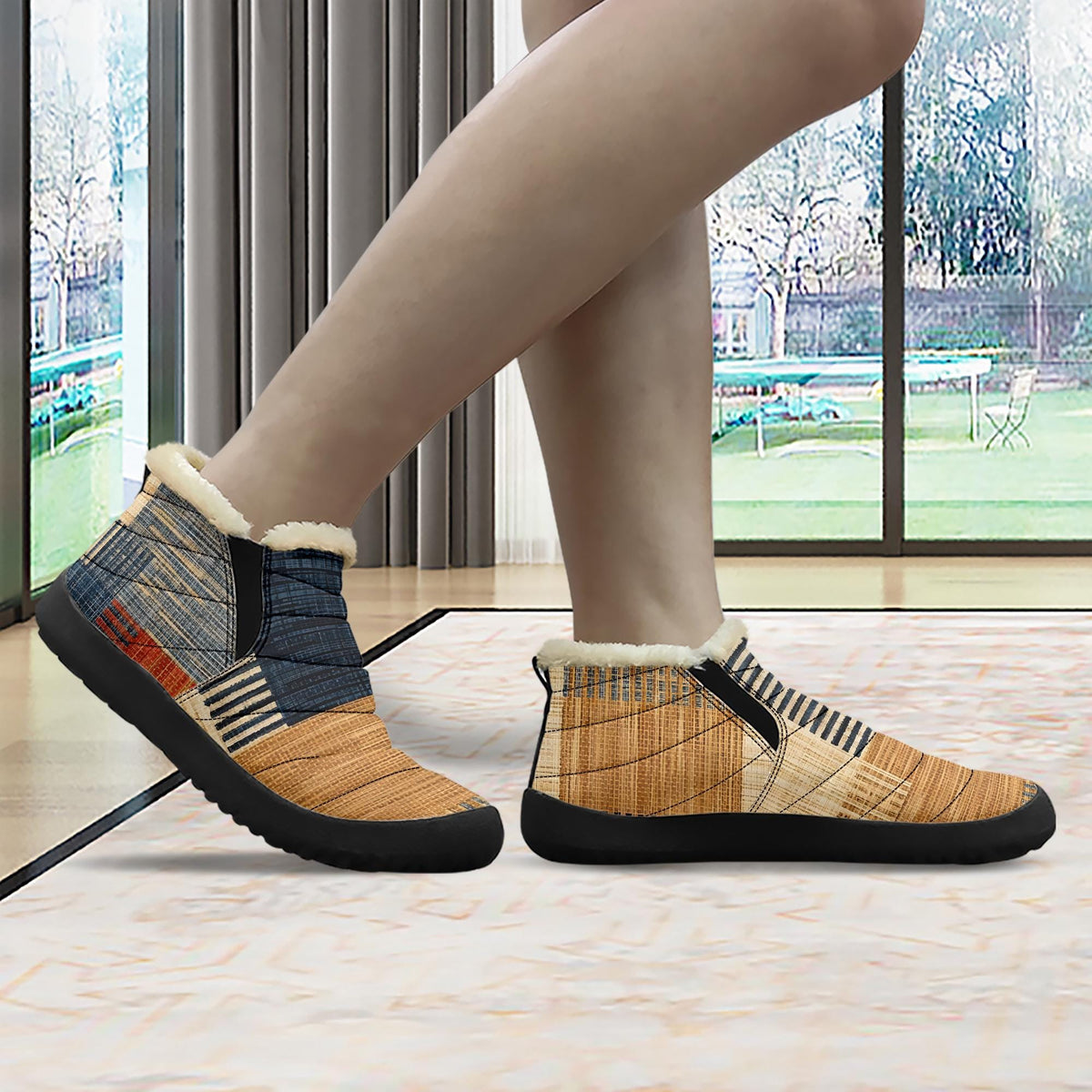 A person's feet wearing colorful, patterned boots are shown in the image.