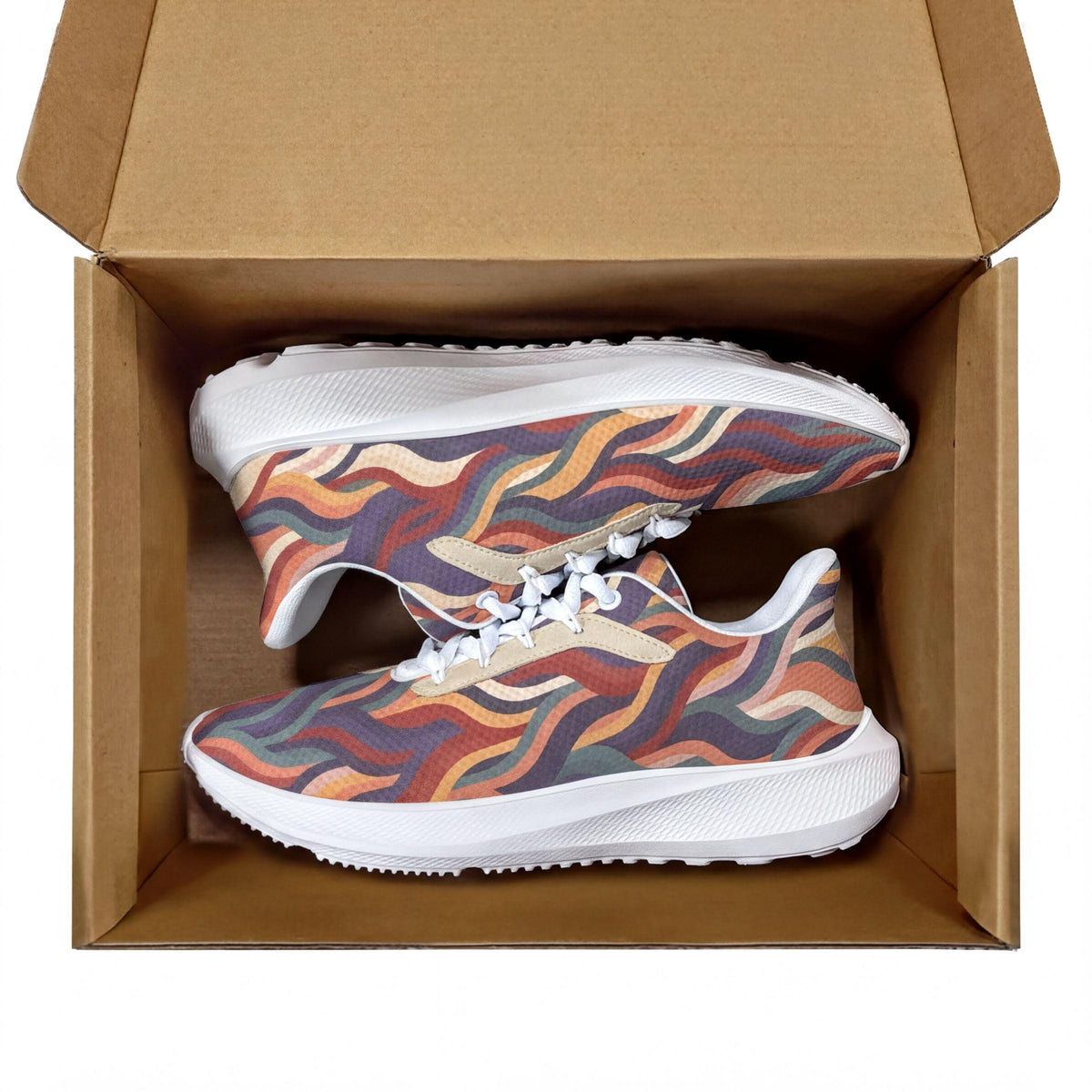 A pair of colorful, patterned sneakers are displayed inside a cardboard box.