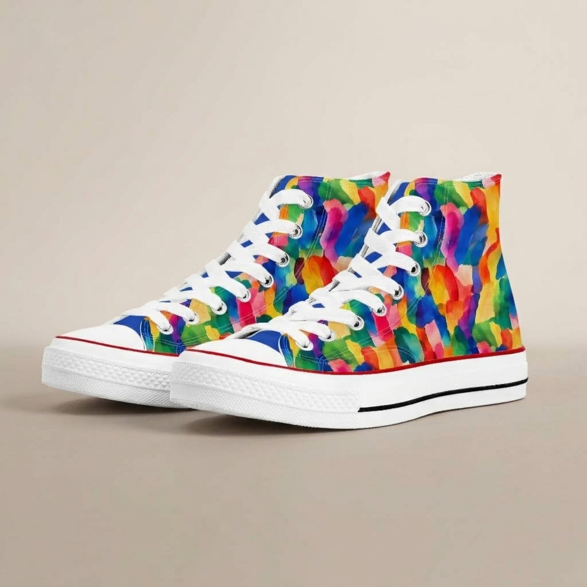 Pair of high top sneakers with colorful abstract brushstroke print on a beige background, front three-quarter view