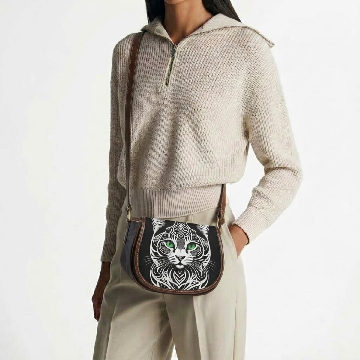 Model wearing cat crossbody bag with sweater and trousers