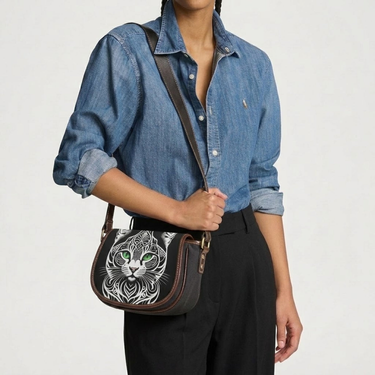 Cat shoulder bag worn on shoulder with denim shirt