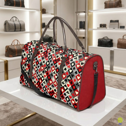 A red and black patterned duffle bag with brown handles sits on a white display table inside a modern, well-lit luxury bag boutique.