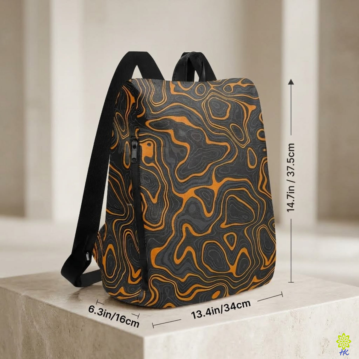 A backpack with a black and orange topographic contour pattern, displayed on a stone pedestal with dimension lines indicating its height, width, and depth.