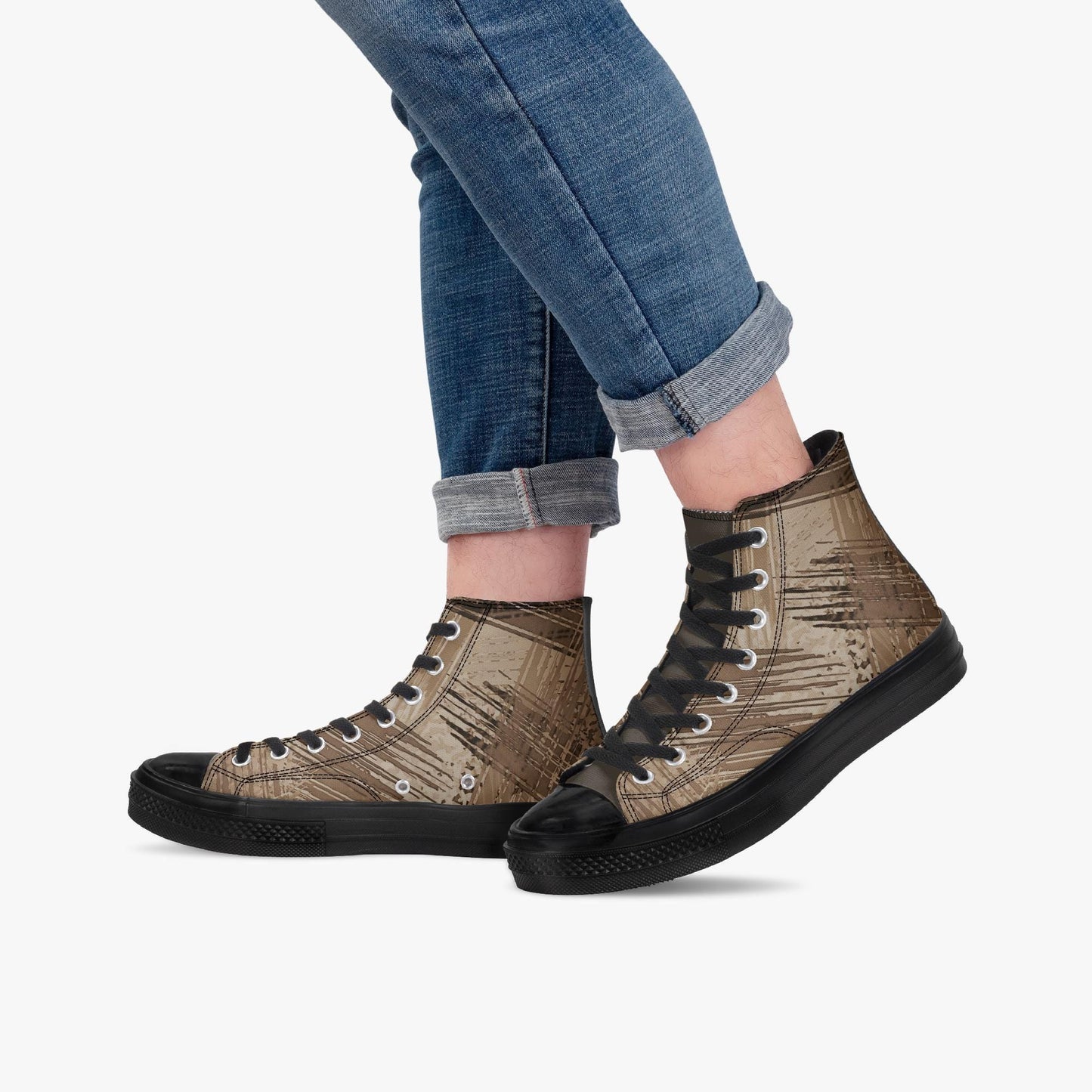 A person wearing blue jeans and brown high-top sneakers with a distinctive pattern.