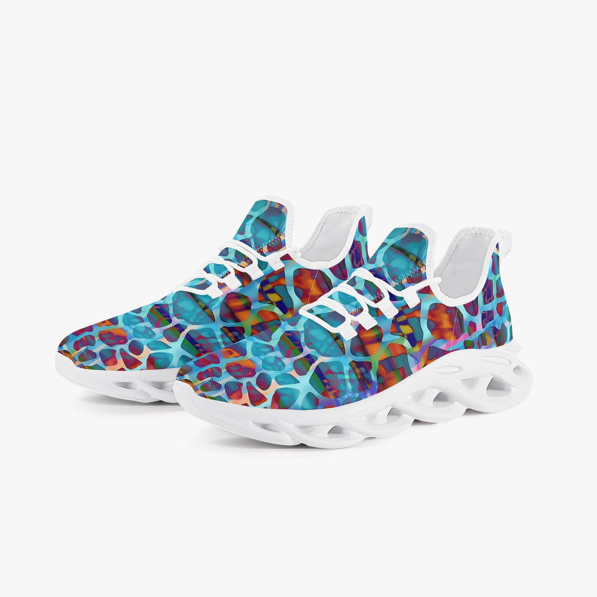A pair of low-top sneakers featuring a vibrant, multicolored abstract organic pattern in shades of blue, purple, orange, and red, paired with chunky white sculpted soles and white laces, set against a plain light gray background.