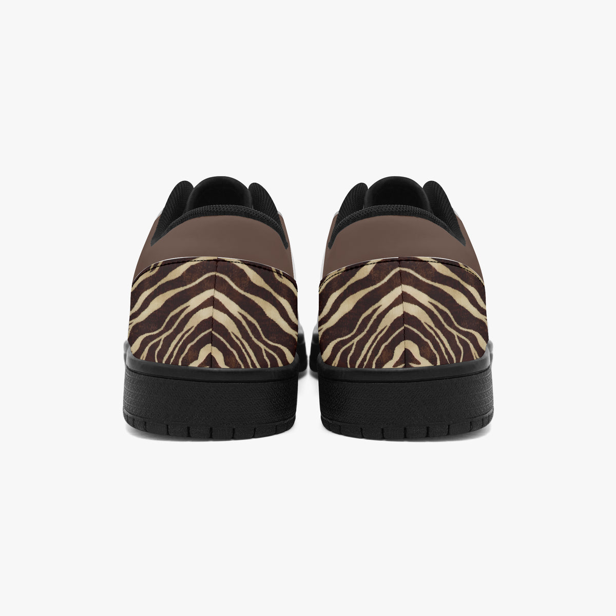 Zebra print sneakers angled on a white background