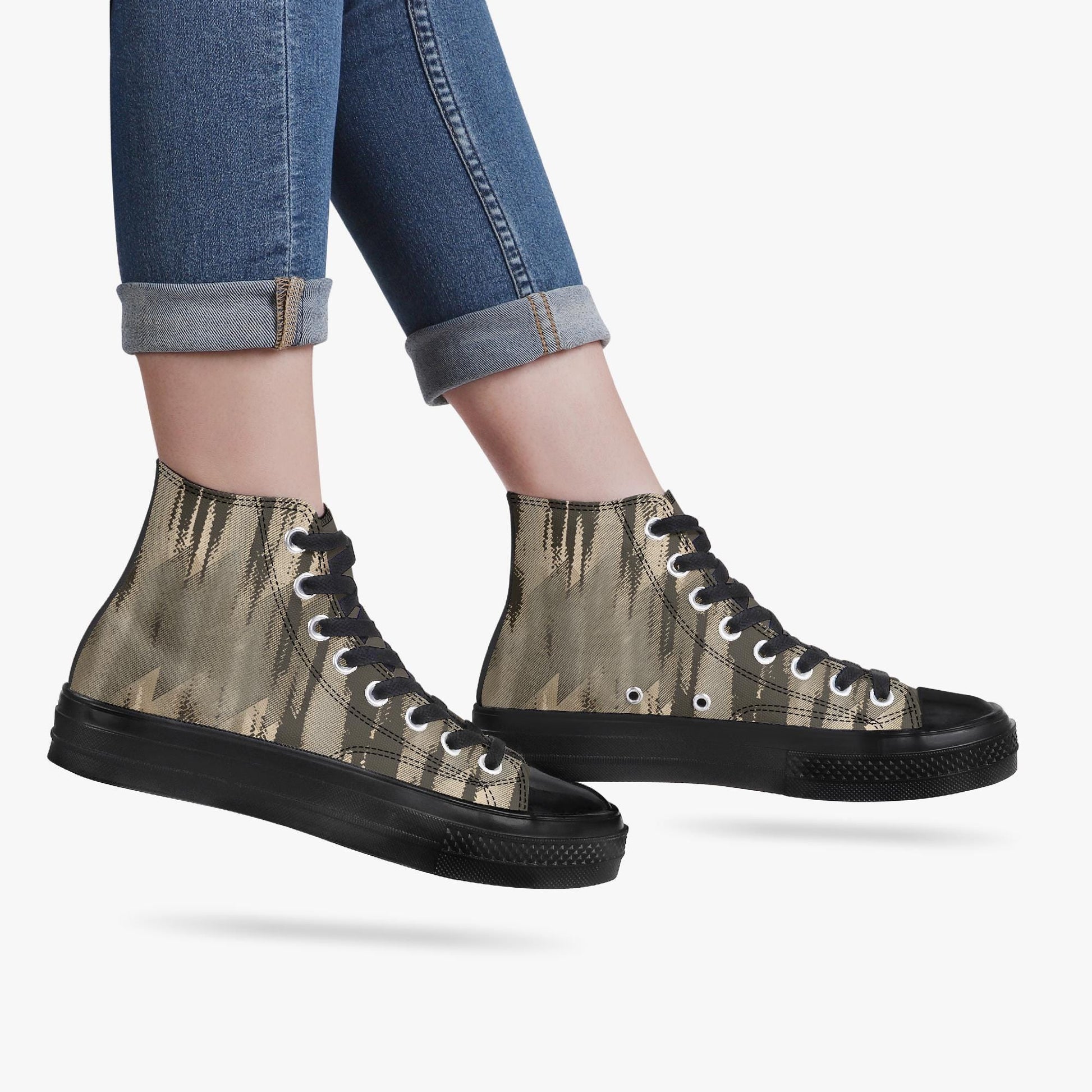 A pair of black and tan high-top sneakers with a camouflage pattern.