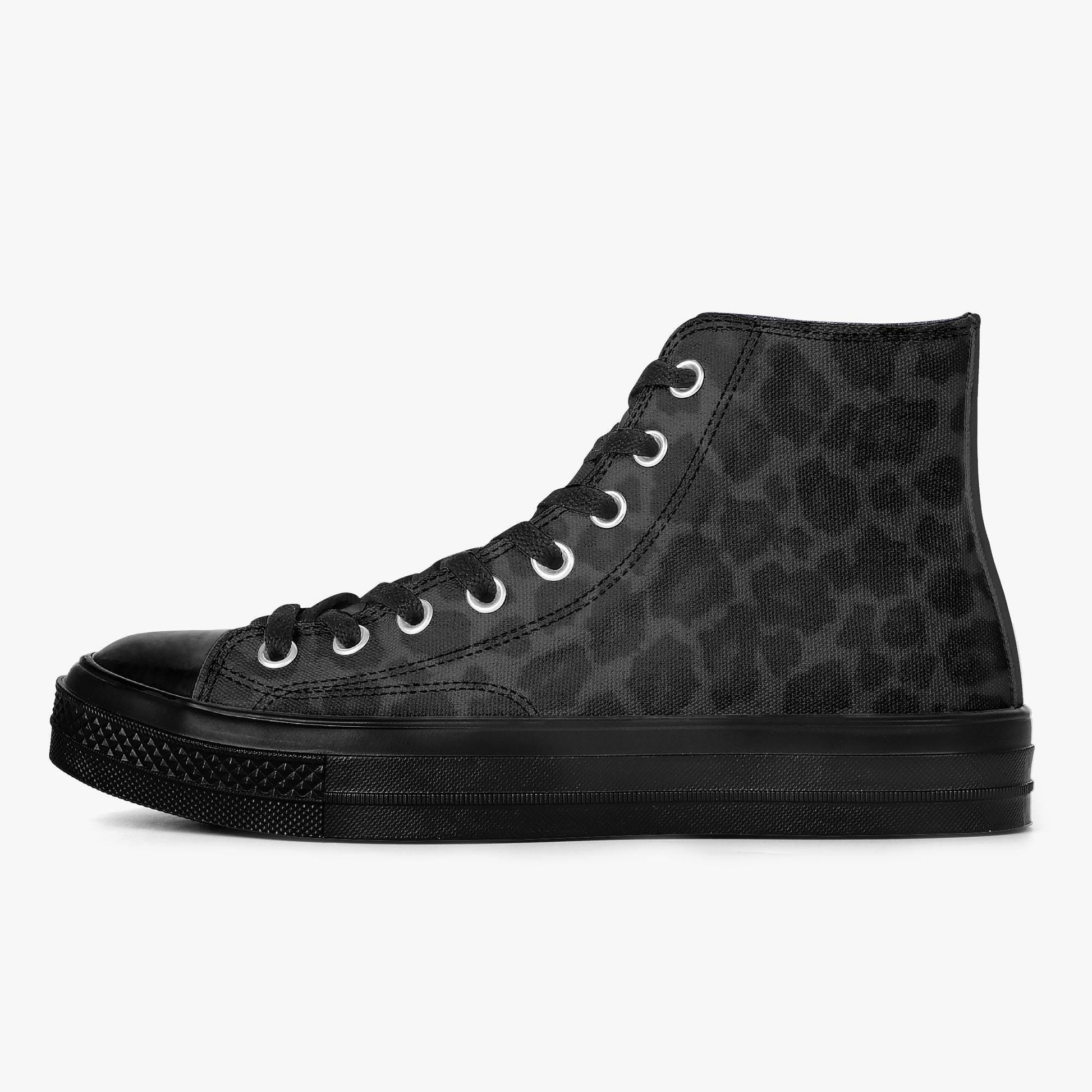 A black high-top sneaker with a leopard print pattern.