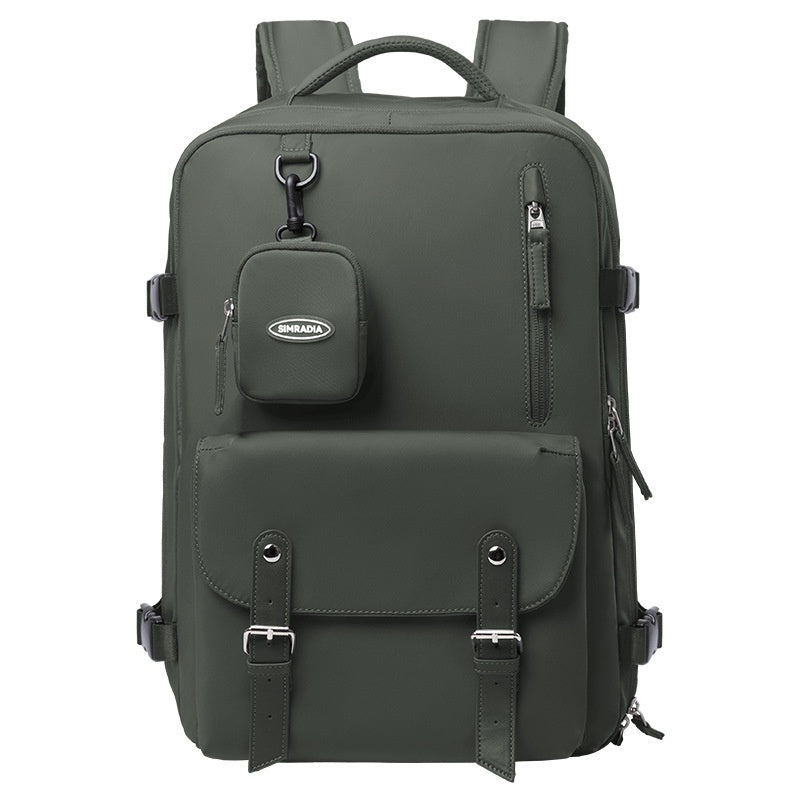 Front view of deep forest green travel backpack with detachable pouch and multiple zippered compartments