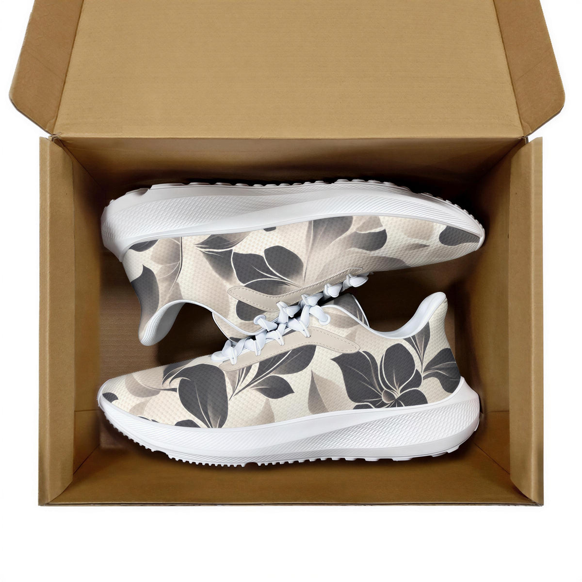 A pair of white sneakers with a floral pattern inside a cardboard box.
