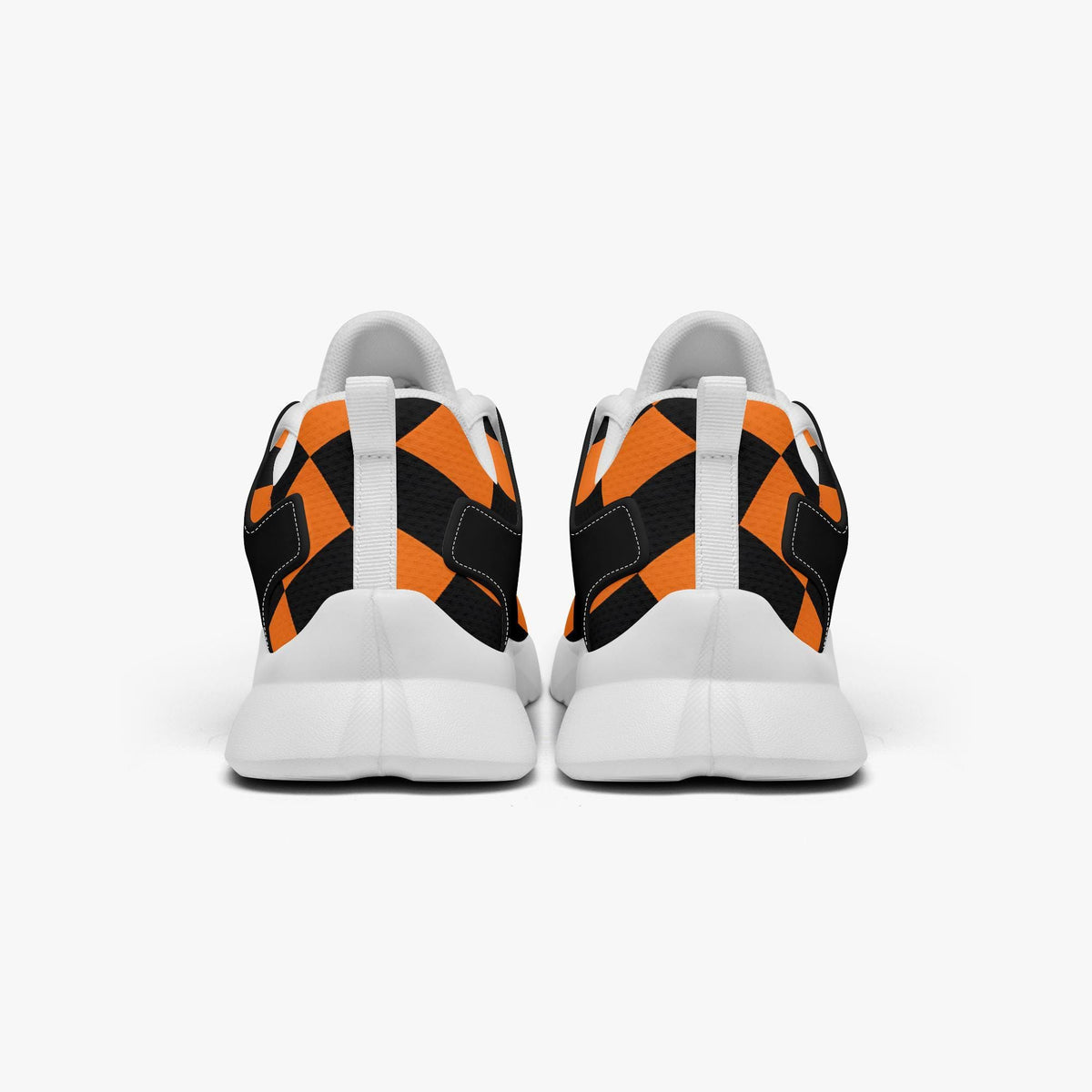 A pair of white and orange sneakers with a black and orange checkered pattern on the back.