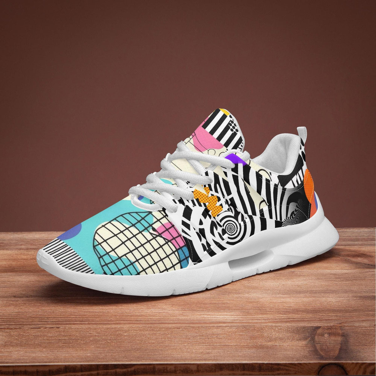 A colorful and patterned sneaker with a zebra print design, displayed on a wooden surface.