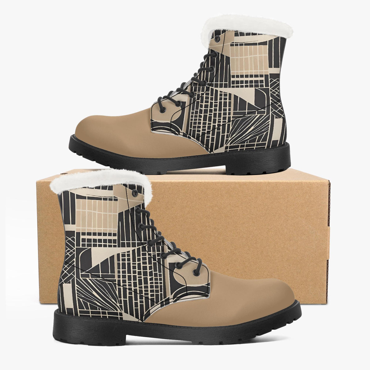 A pair of tan boots with a geometric pattern on the side, placed on top of a cardboard box.