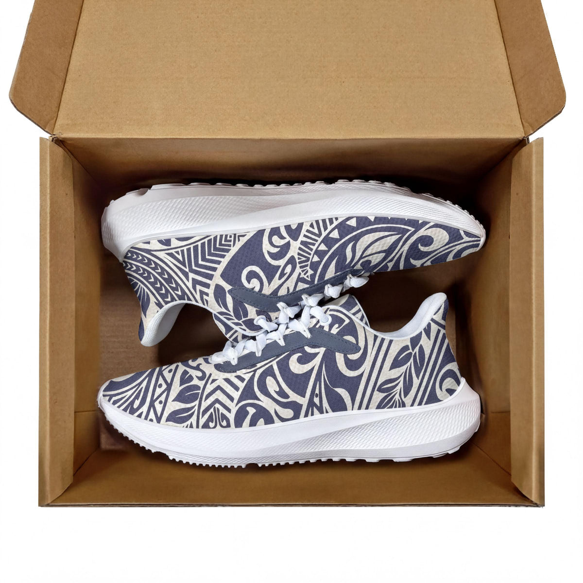A pair of white and blue patterned sneakers are displayed inside a cardboard box.