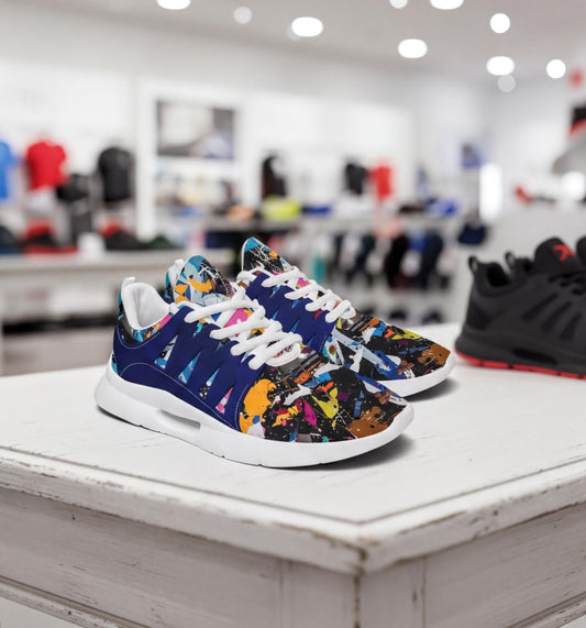 A pair of colorful sneakers with a vibrant, abstract pattern on the side, displayed on a white surface in a retail setting.