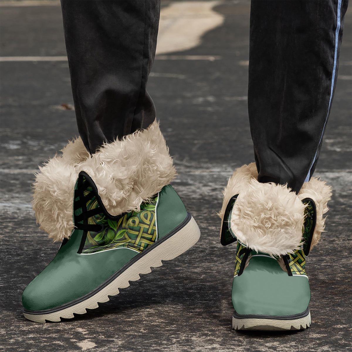 A close-up of a person's feet wearing green and white furry boots with a patterned design.