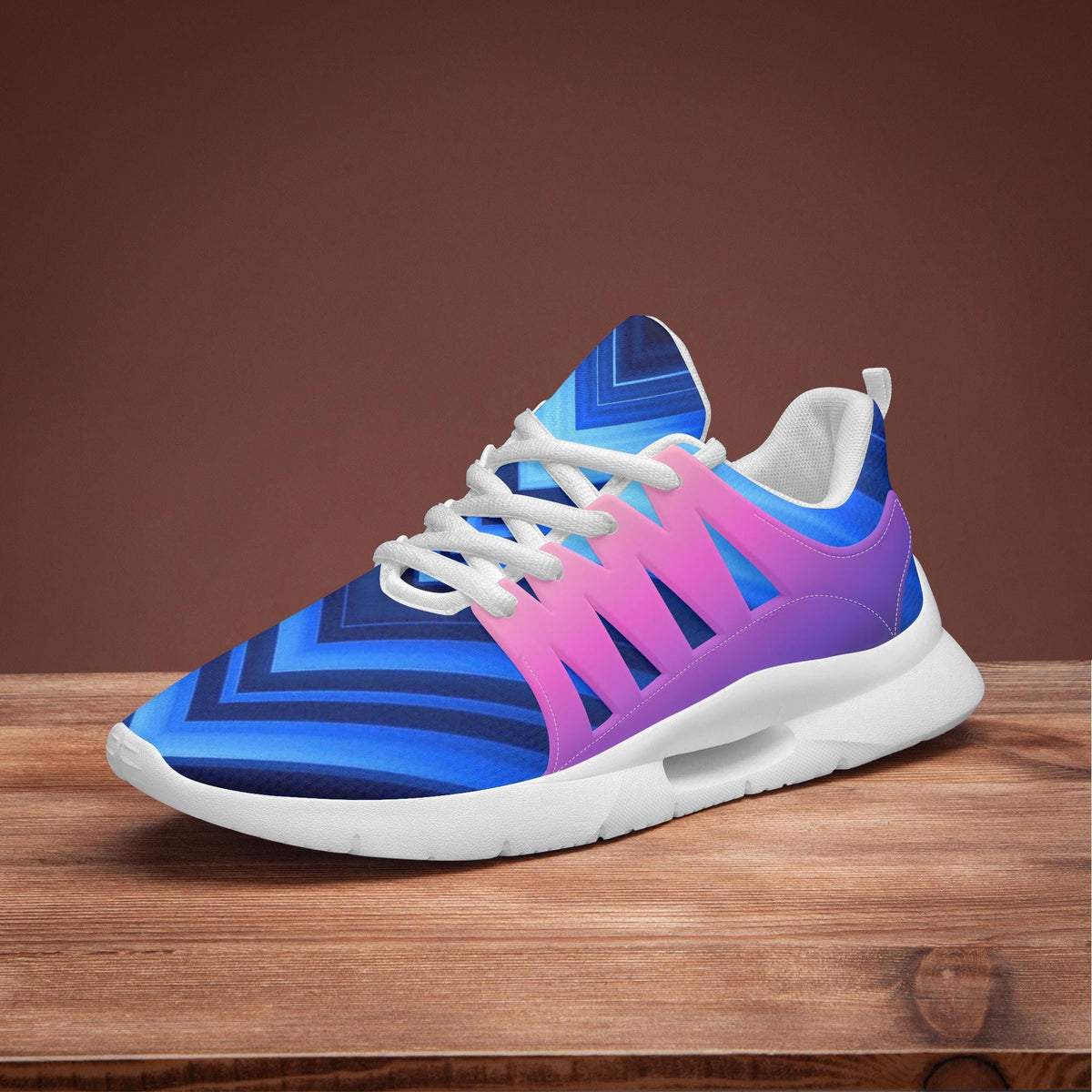 A colorful and patterned sneaker is displayed on a wooden surface against a brown background.